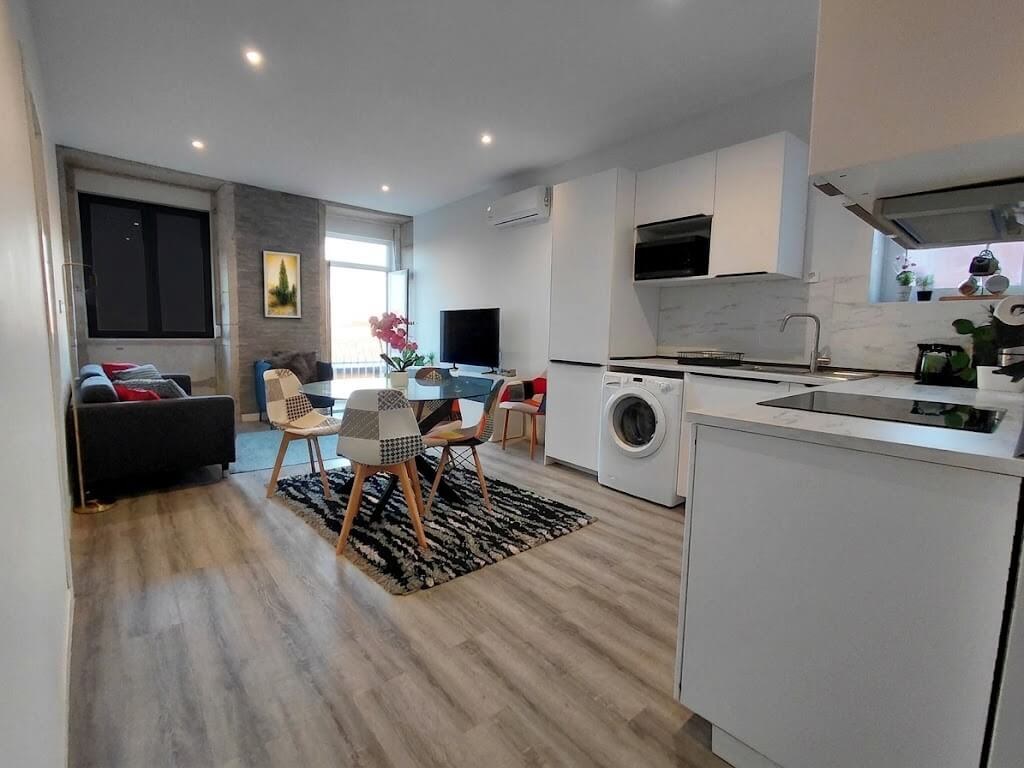 General view of the open-space concept, living room connected to the kitchen, Porto Skyline Center Residence